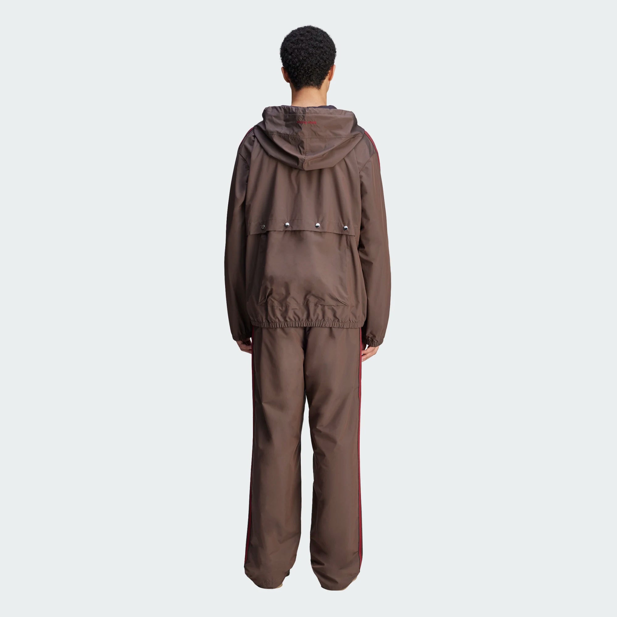 Front view of Wales Bonner x adidas night brown nylon anorak showing half-zip placket and embroidered logos