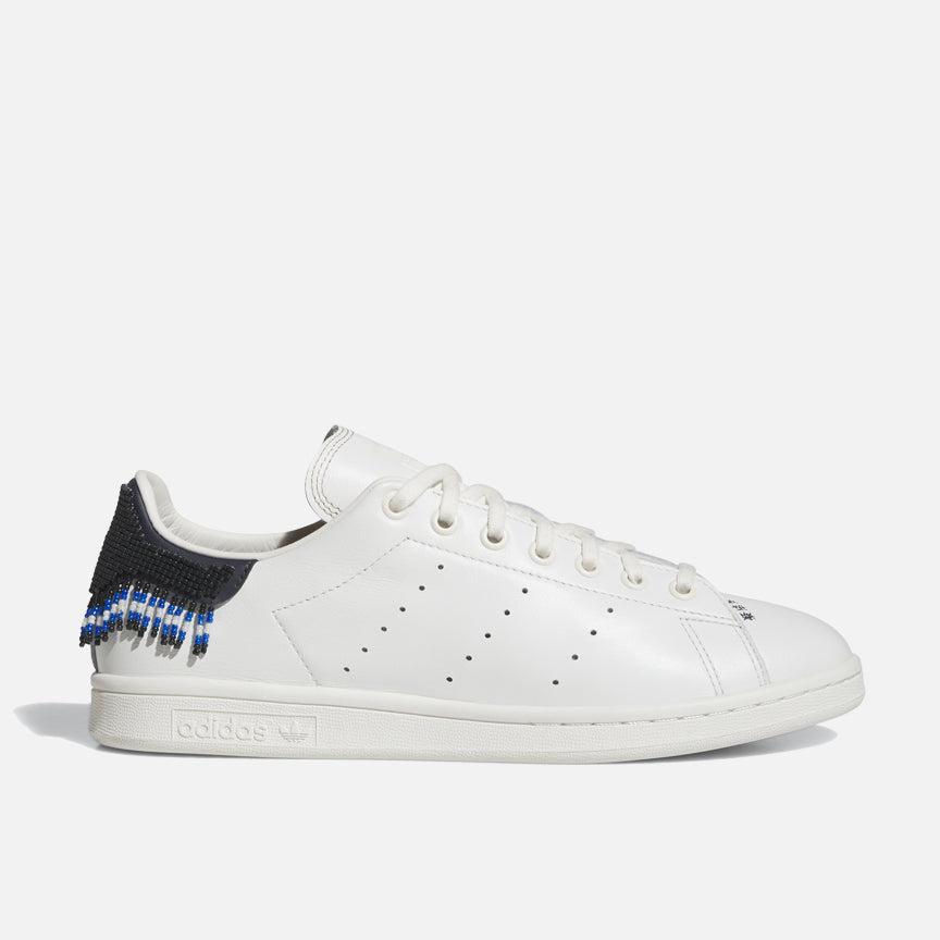Side view of CLOT x adidas Stan Smith Beaded sneakers with beaded heel tab