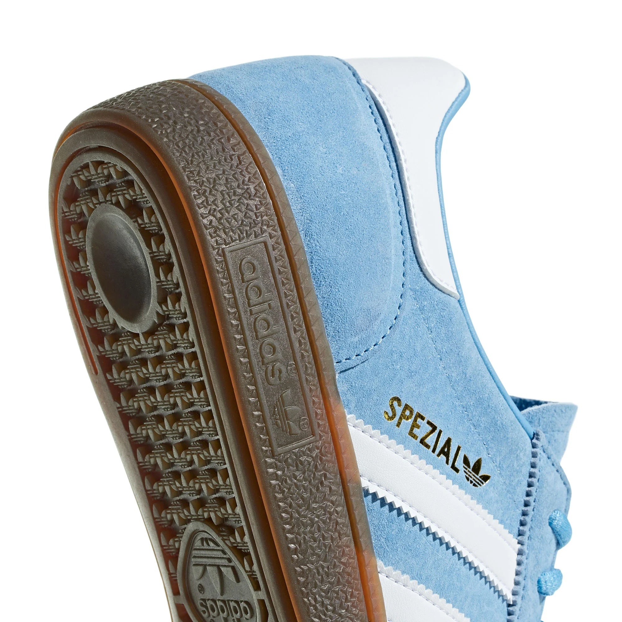 Side view of Handball Spezial light blue sneaker on a wooden floor.