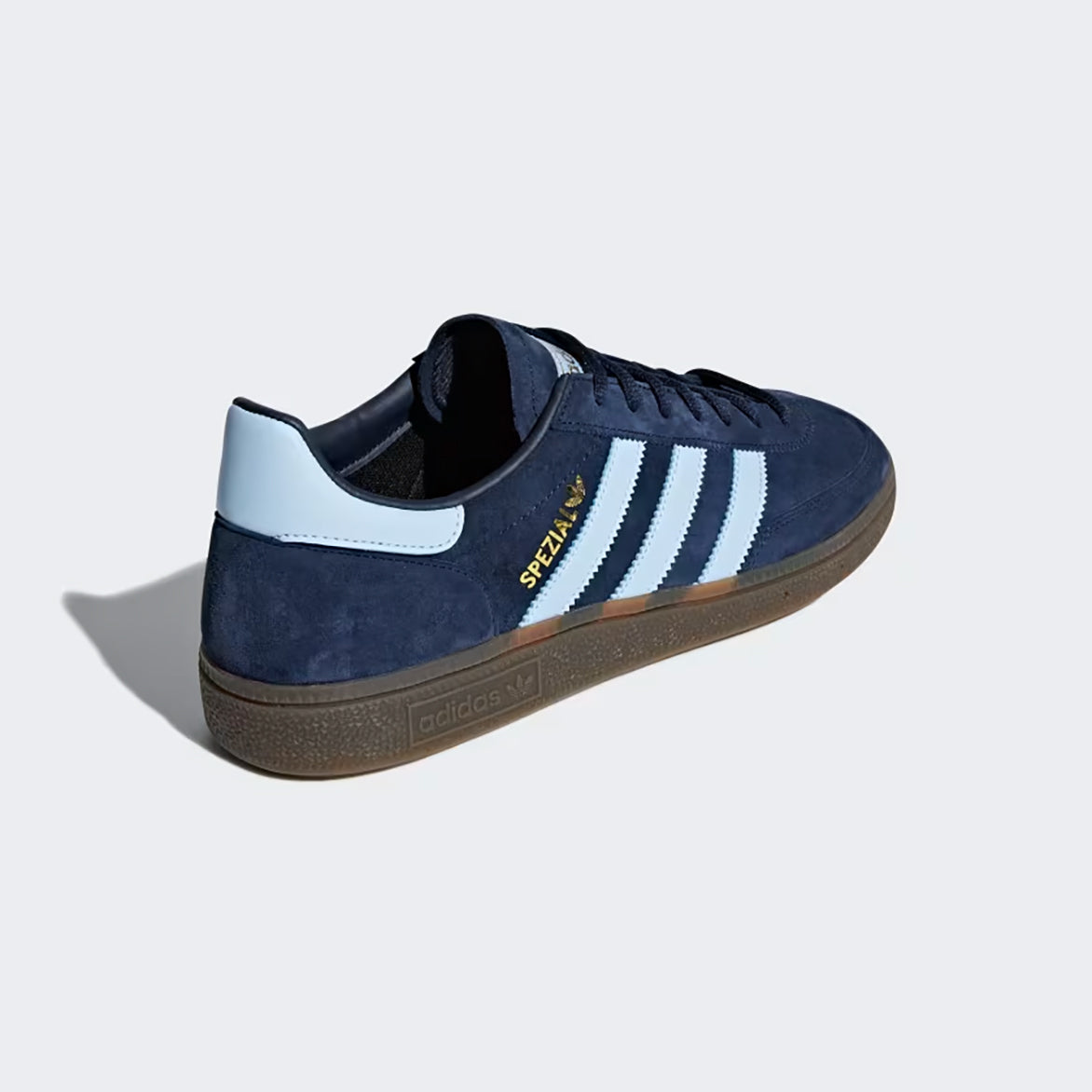 Close-up of the heel tab and gold foil branding on retro sneakers