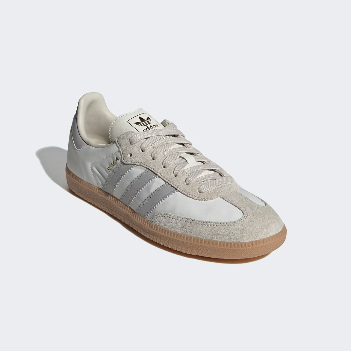 Close-up of the gum rubber outsole and branding details on Adidas Samba OG shoes