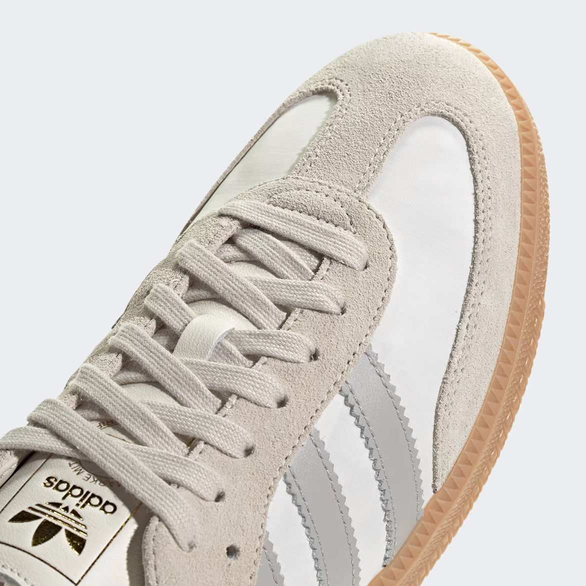 Adidas Samba OG sneakers in off white and grey showing side profile for street style