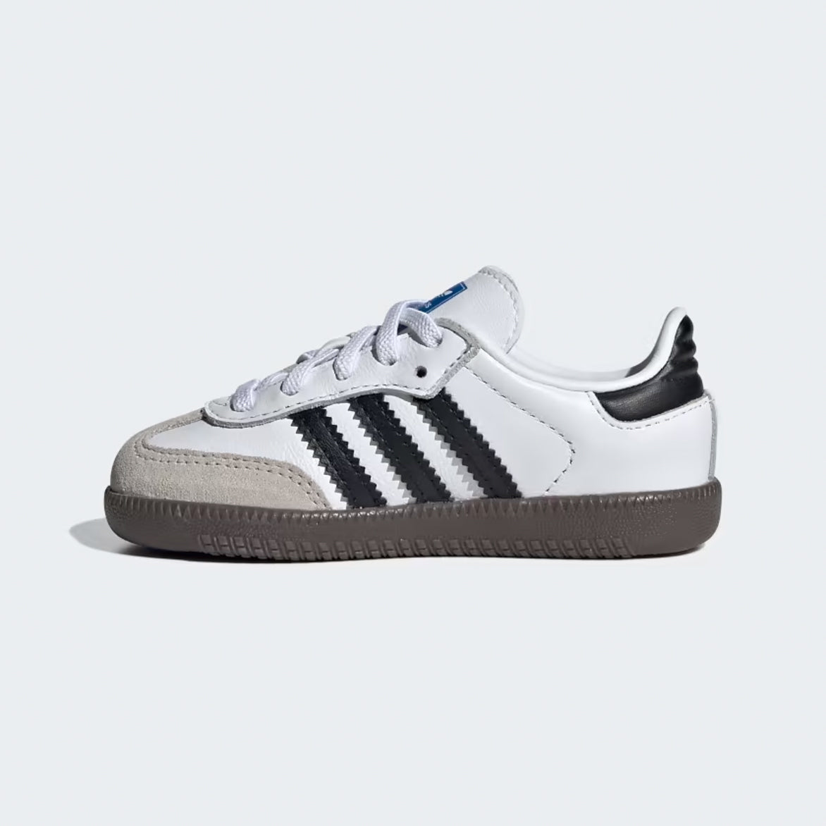 Side view of Adidas Samba OG kids sneakers in Running White and Core Black, highlighting the sleek design.