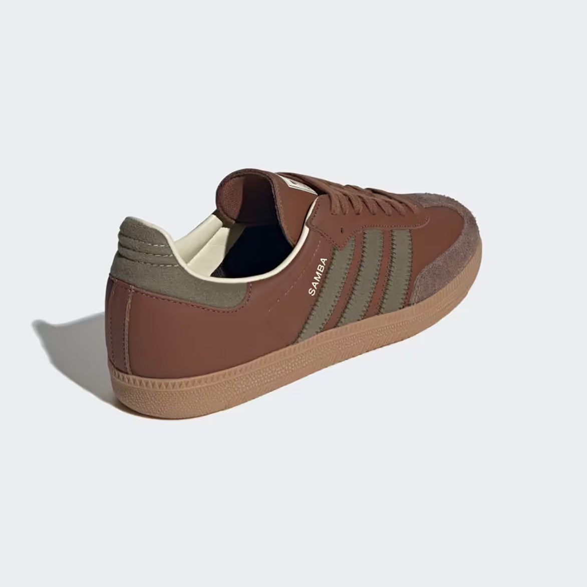 Adidas Samba OG brown sneakers showcasing chocolate leather and olive detailing from the side.