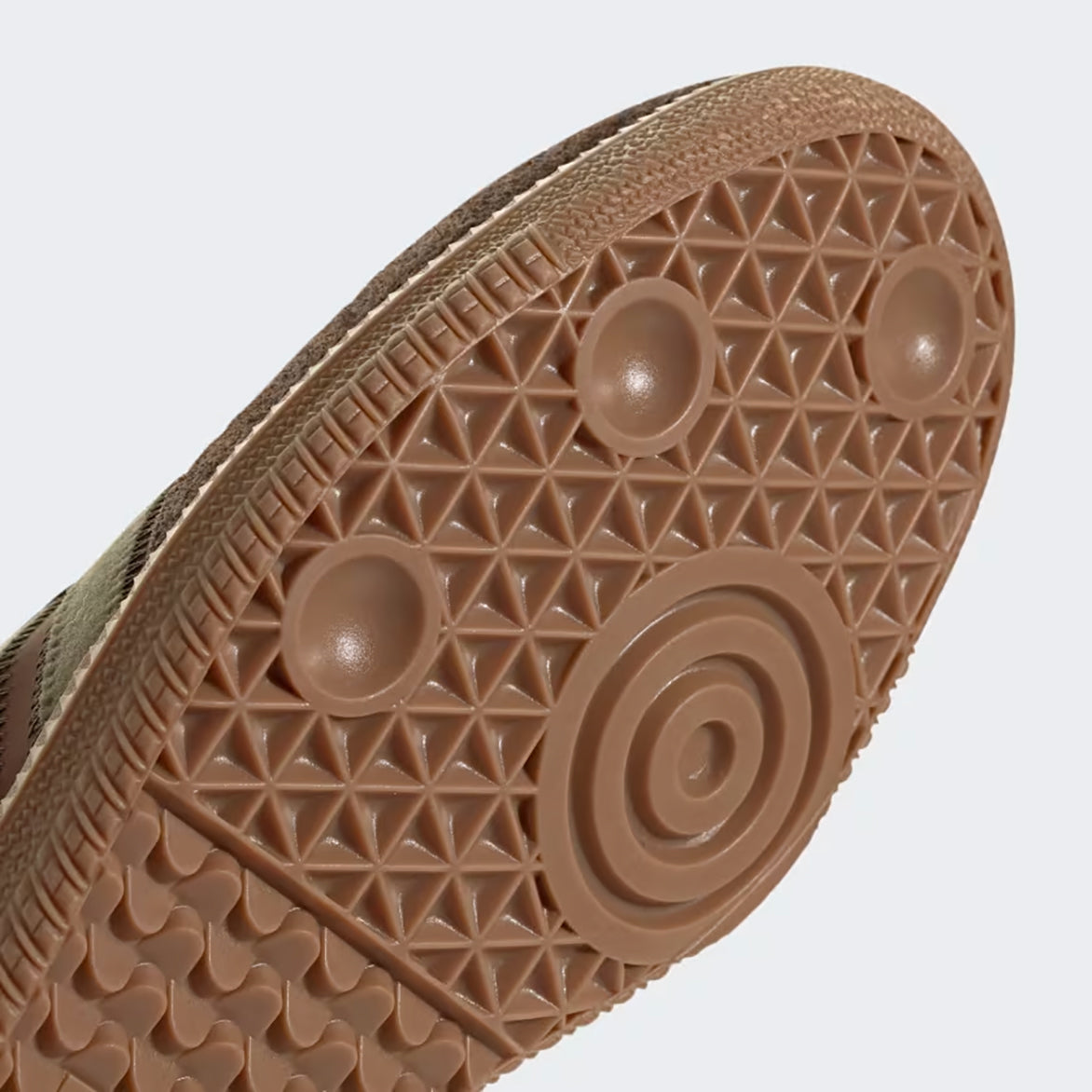 Adidas Samba OG brown sneakers showcasing chocolate leather and olive detailing from the side.