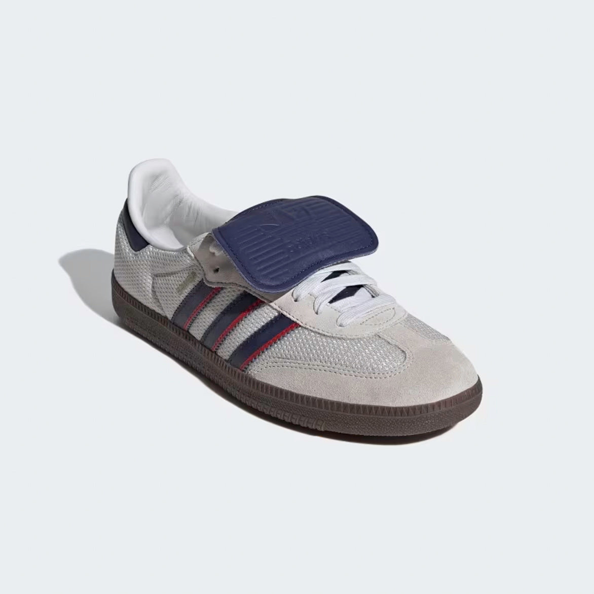 Side profile showcasing tonal suede overlays, dark blue leather 3-Stripes, and gold-foil Samba branding
