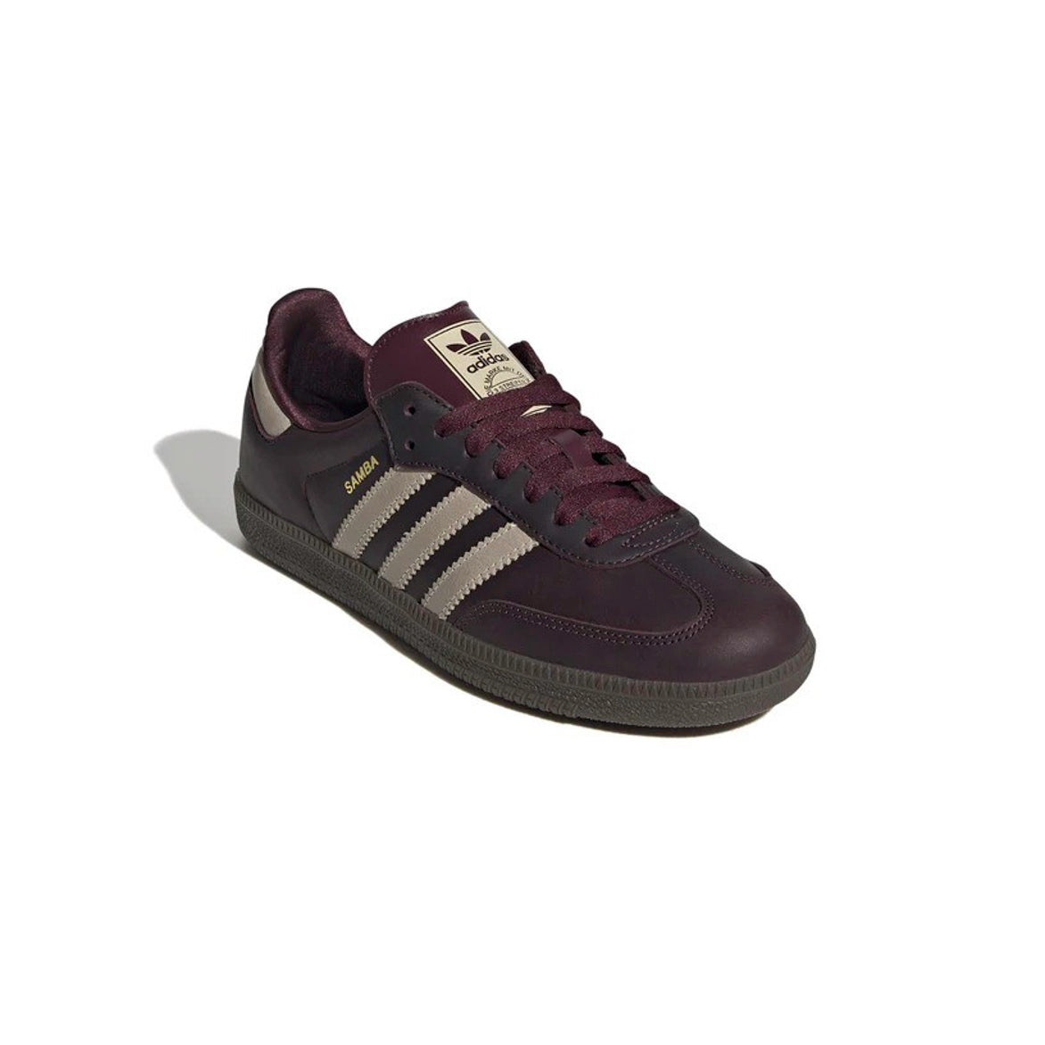 Close-up of the gold foil Samba branding on the side panel of womens Adidas sneakers