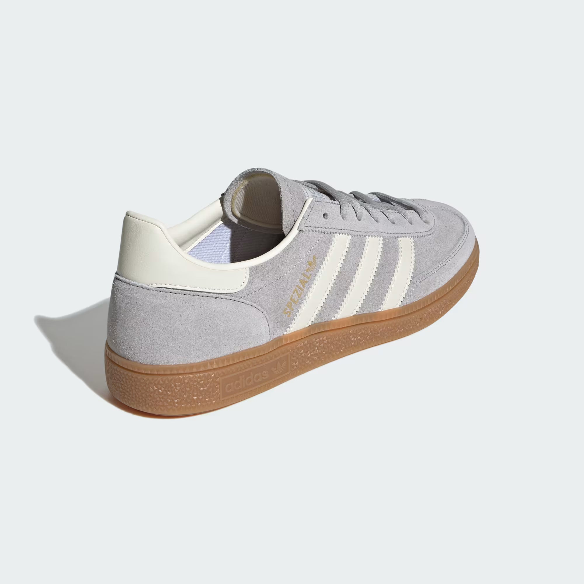 Close-up of the gum rubber outsole and gold SPEZIAL logo on the sneakers