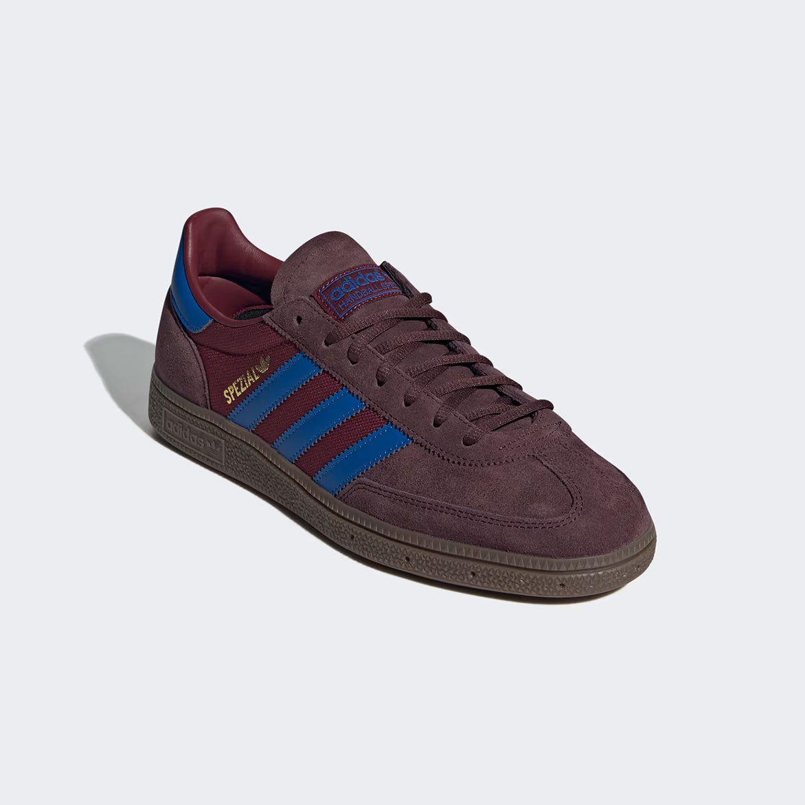 Top-down view of Adidas Handball Spezial Night Red with focus on the tonal laces and gold foil branding.