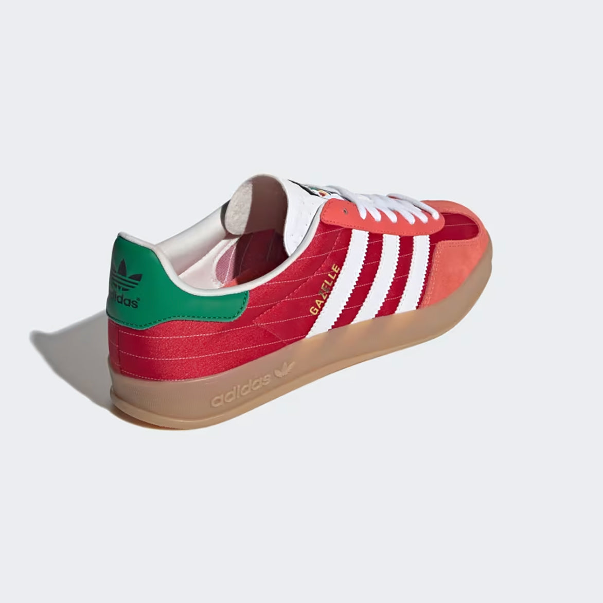 Adidas Gazelle Indoor sneakers in Better Scarlet and Cloud White, showcasing the side view with Three Stripes.
