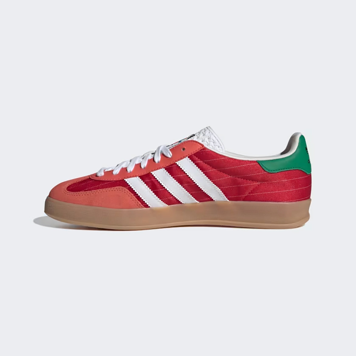 Close-up of the Adidas Gazelle Indoor sneakers highlighting the gum rubber sole and textured tongue.