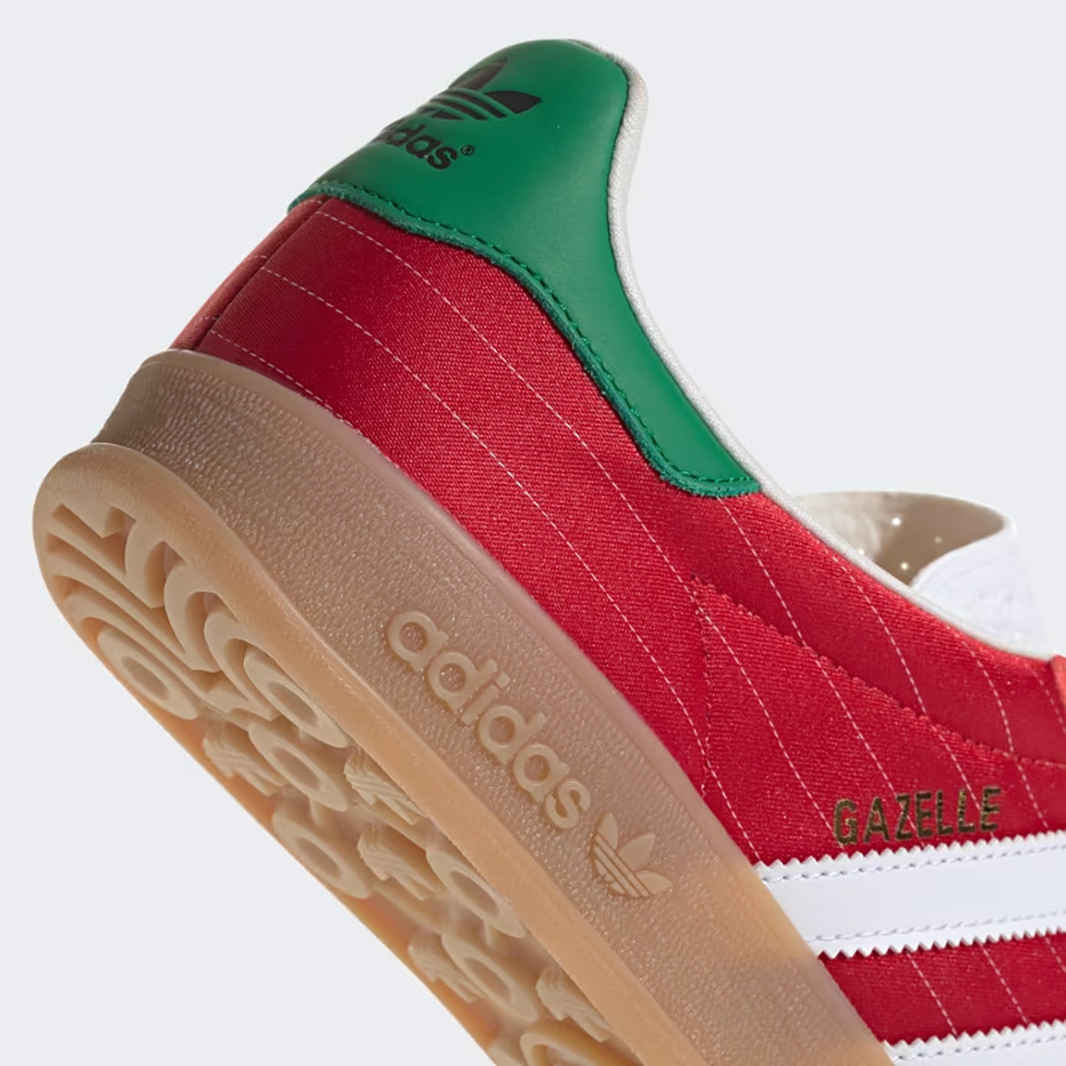 Close-up of the Adidas Gazelle Indoor sneakers highlighting the gum rubber sole and textured tongue.