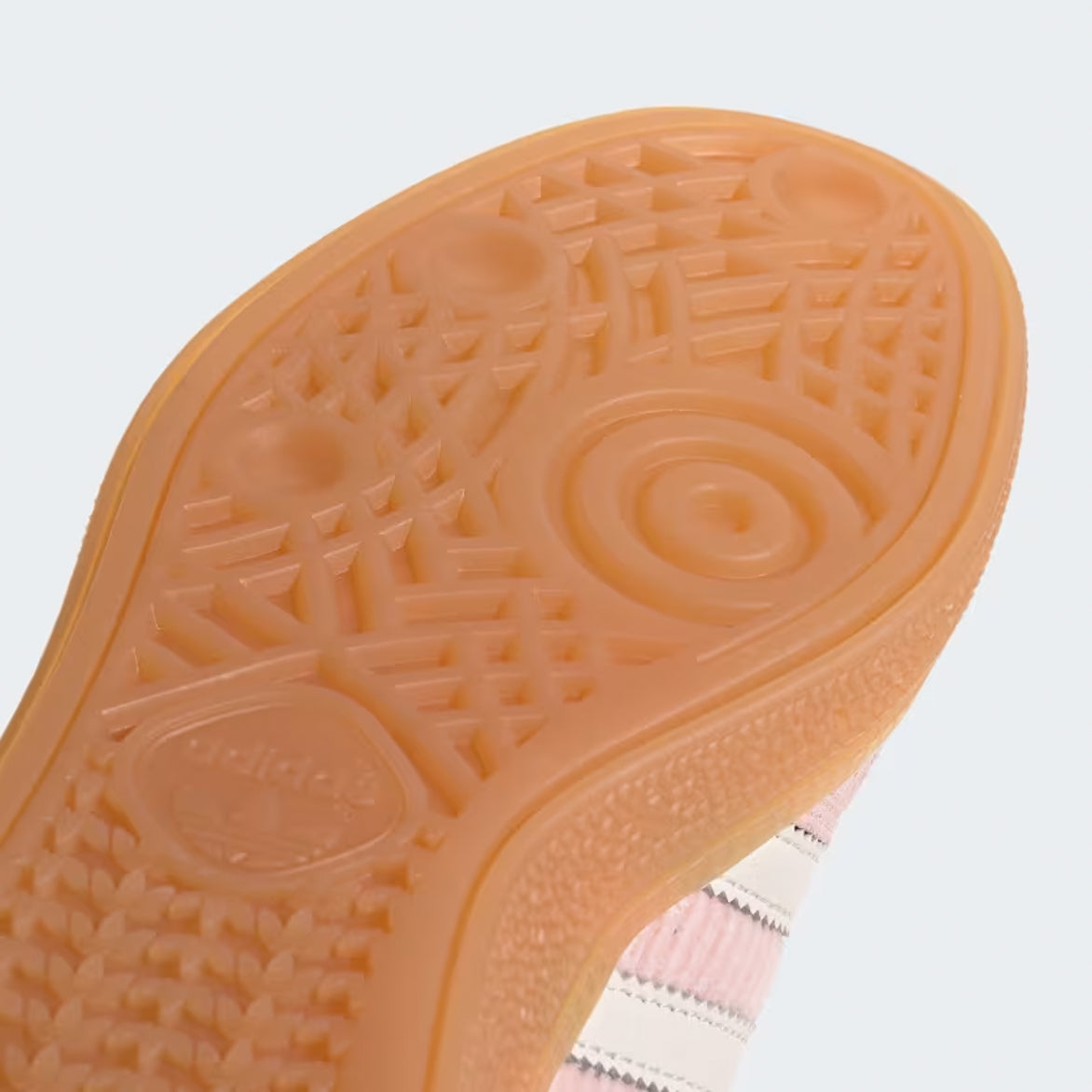 Close-up of the gum rubber outsole of the retro sneakers for enhanced grip.