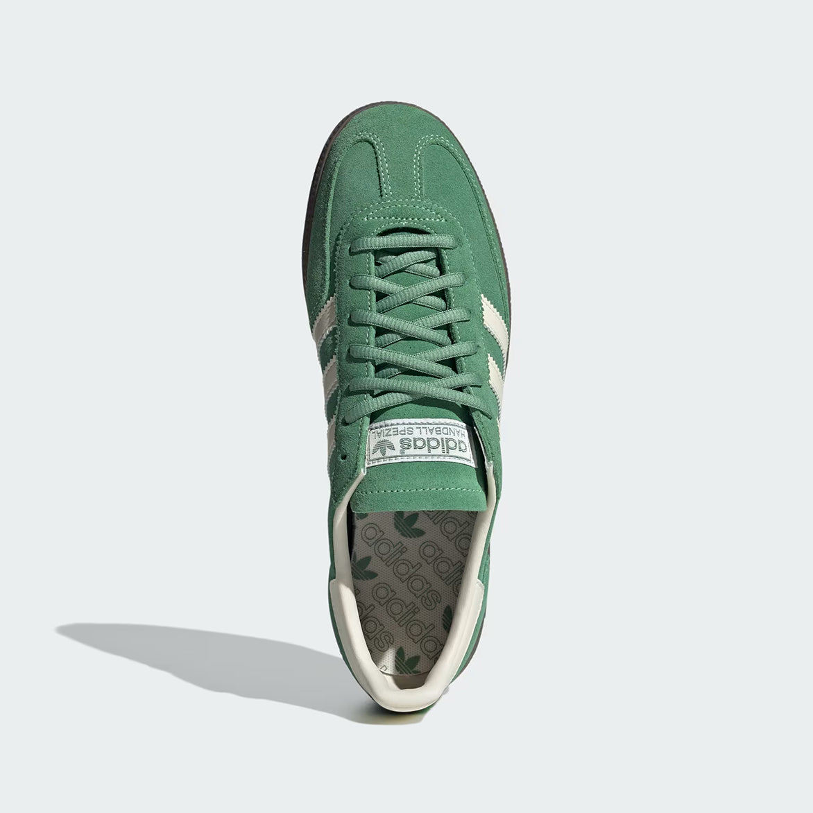 Side view of Handball Spezial vintage sneakers showcasing the green suede and cream leather details.