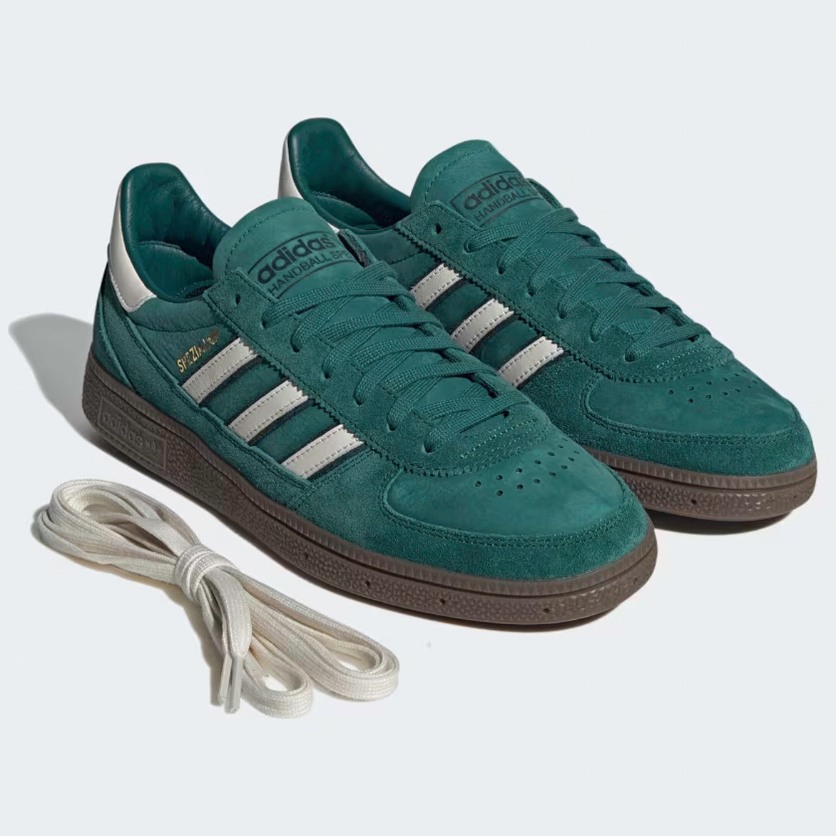 Top-down shot of adidas Handball Spezial Noble Green mens size 9 on concrete, white 3-Stripes gleaming