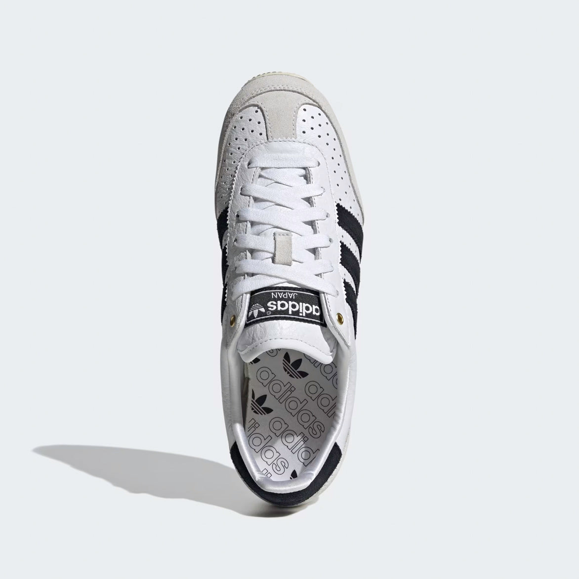 Styled shot of Adidas Japan sneakers with aged rubber sole and vintage design details