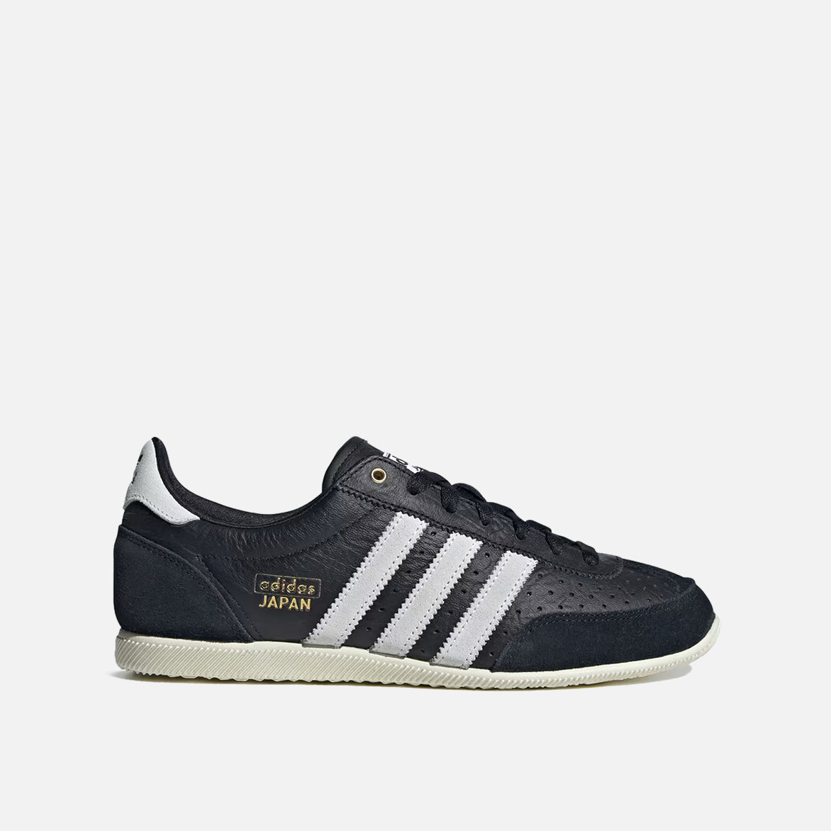 Side view of Adidas Women's Japan limited edition sneakers with black leather and white suede overlays