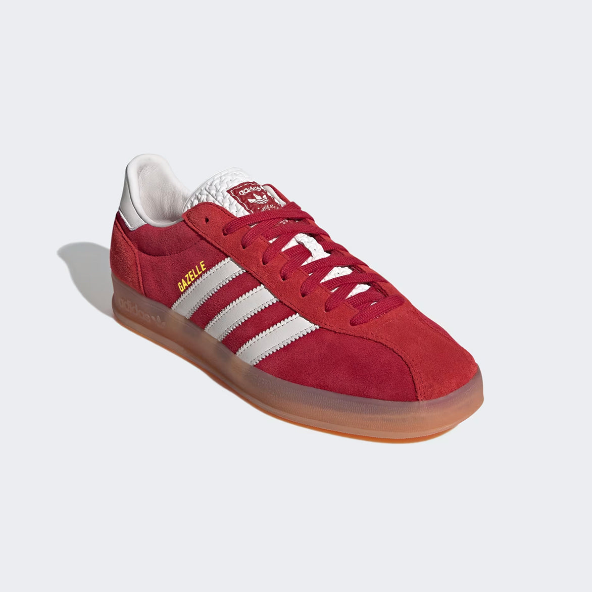 Side view of the Gazelle Indoor Pro sneakers in Team Victory Red, highlighting the classic Three Stripes.