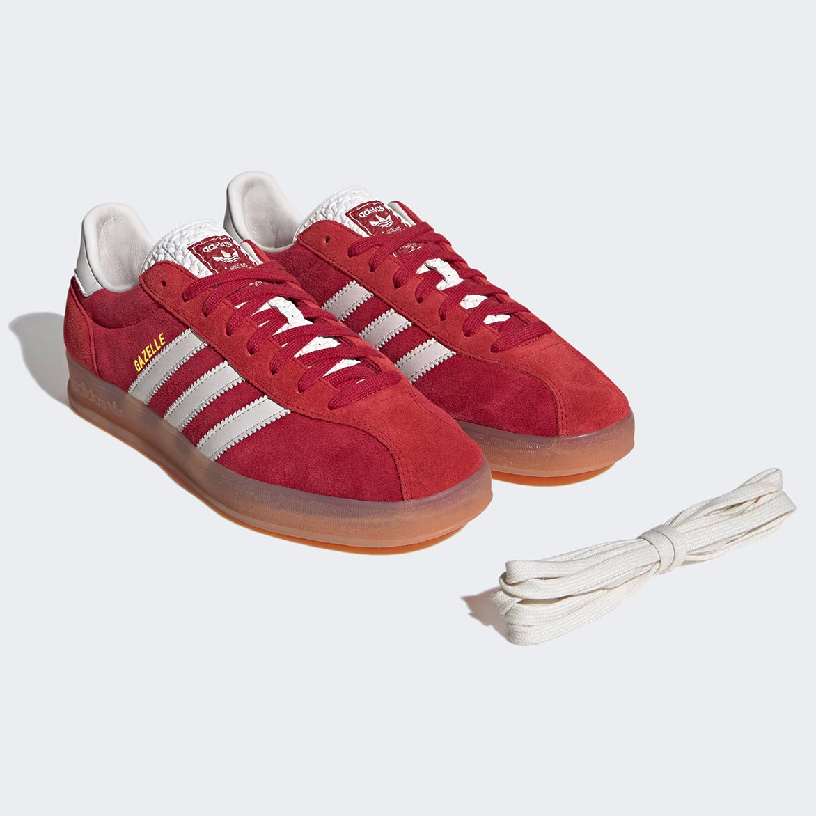 Close-up of Victory Red Gazelle Indoor Pro sneakers showcasing the suede texture and white leather details.