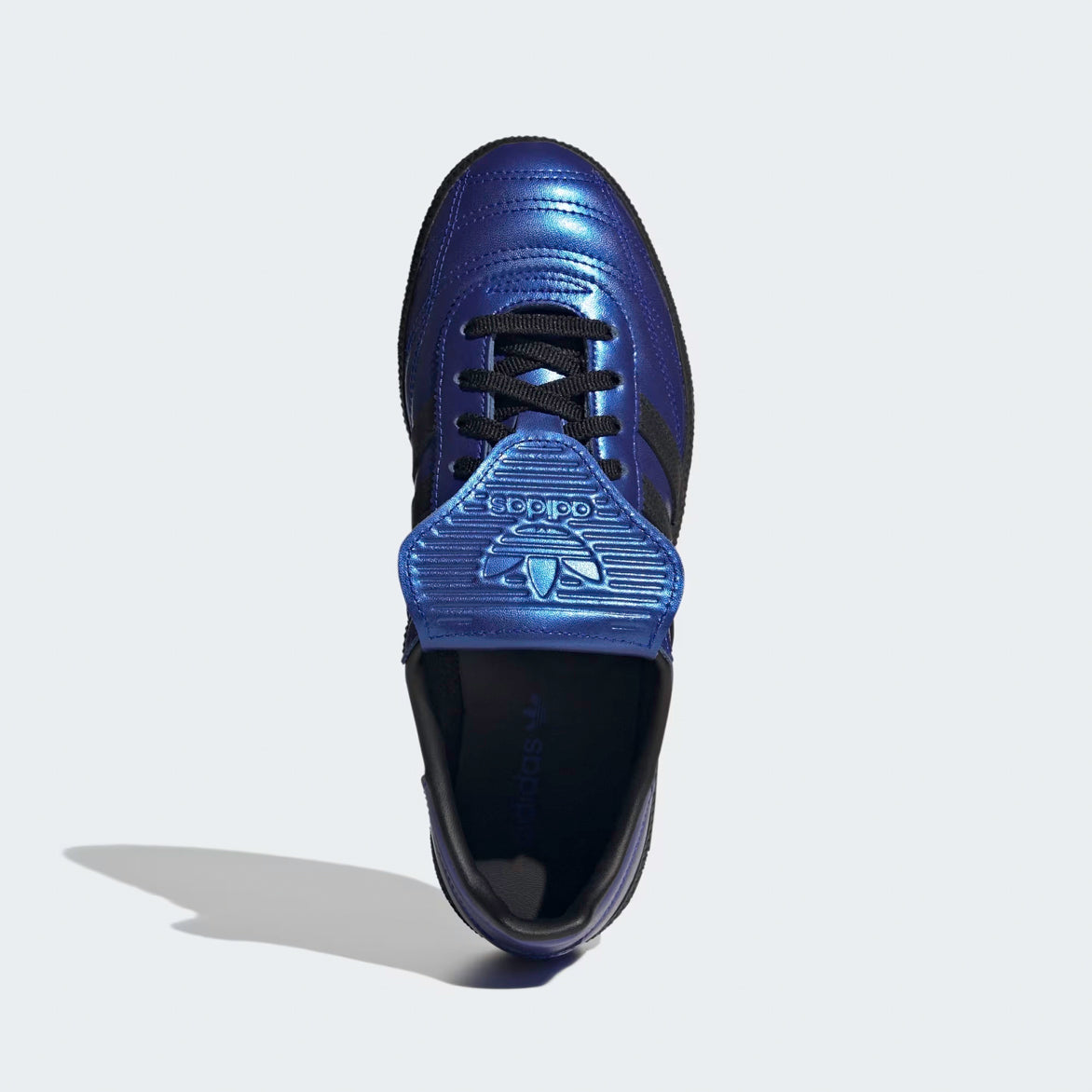Close-up of women’s handball spezial sneakers showing textured blue tongue and black leather accents