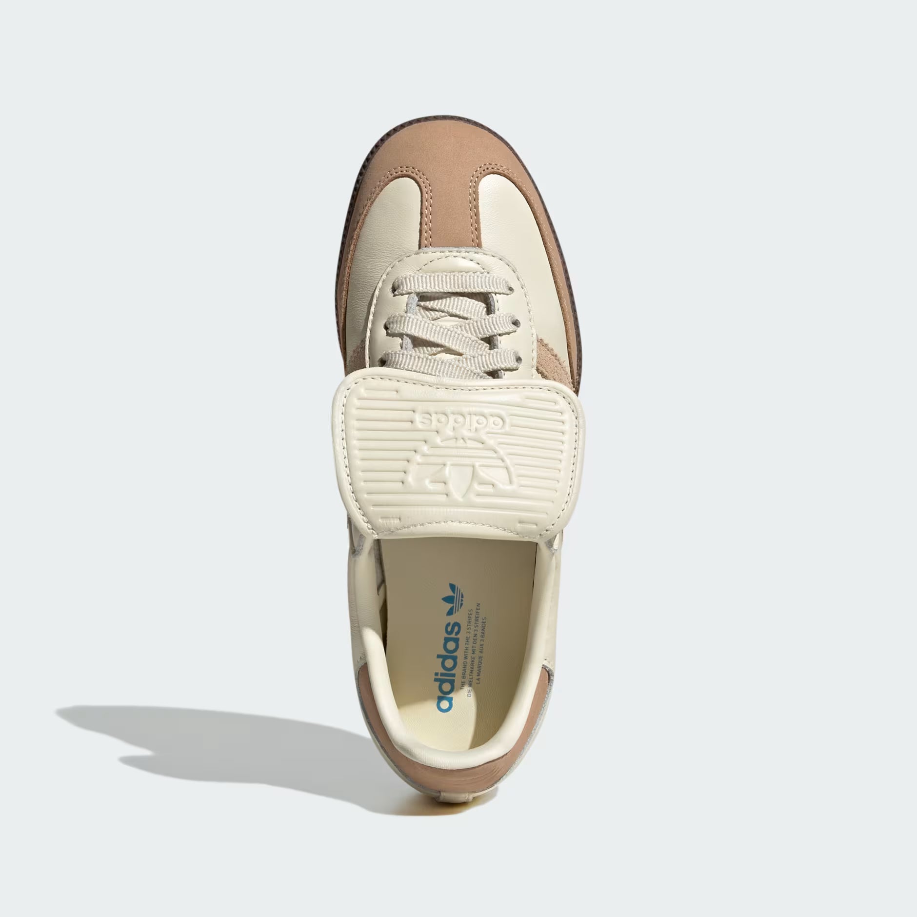 Side view of Adidas Samba Long Tongue womens sneakers in cream white, perfect for indoor soccer.