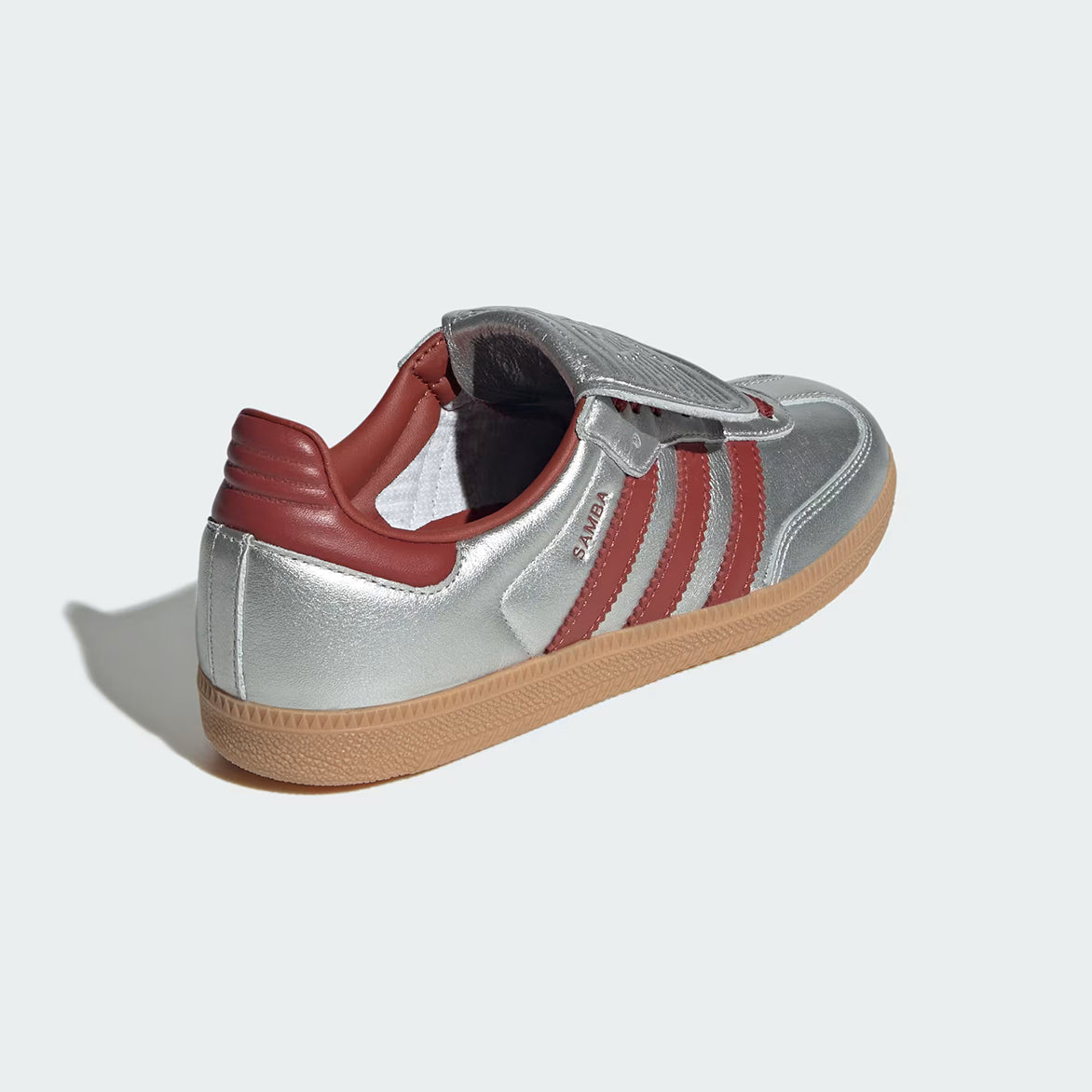 Samba Long Tongue sneakers displayed against an urban backdrop, emphasizing their stylish design.