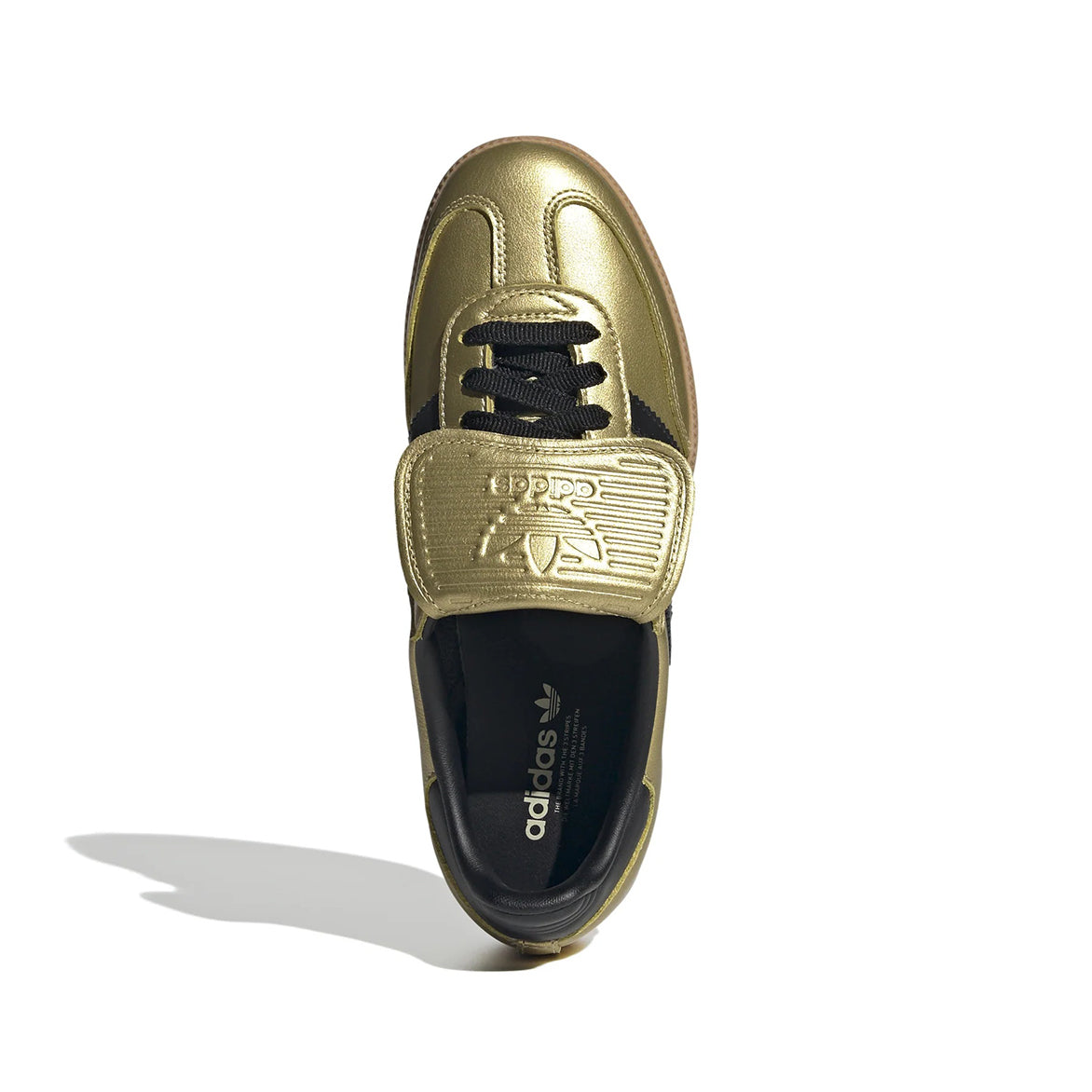 Womens metallic sneakers with gold leather finish and streetwear style, side view