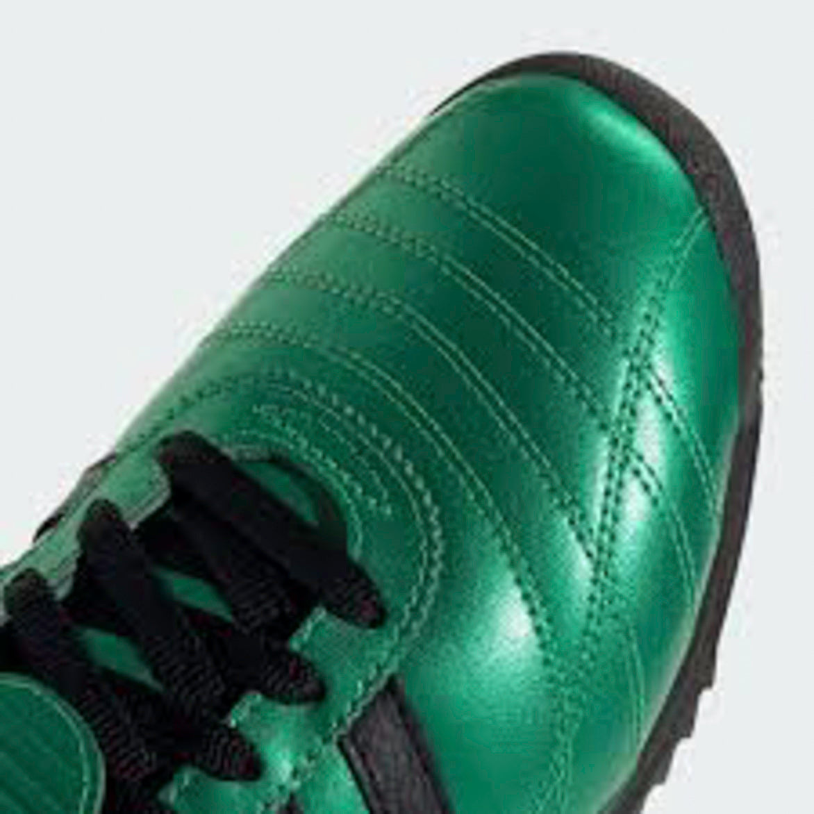 Close-up view of Adidas SL 72 OG Womens Retro Sneakers in Semi Screaming Green, highlighting the textured foldover tongue and leather upper.