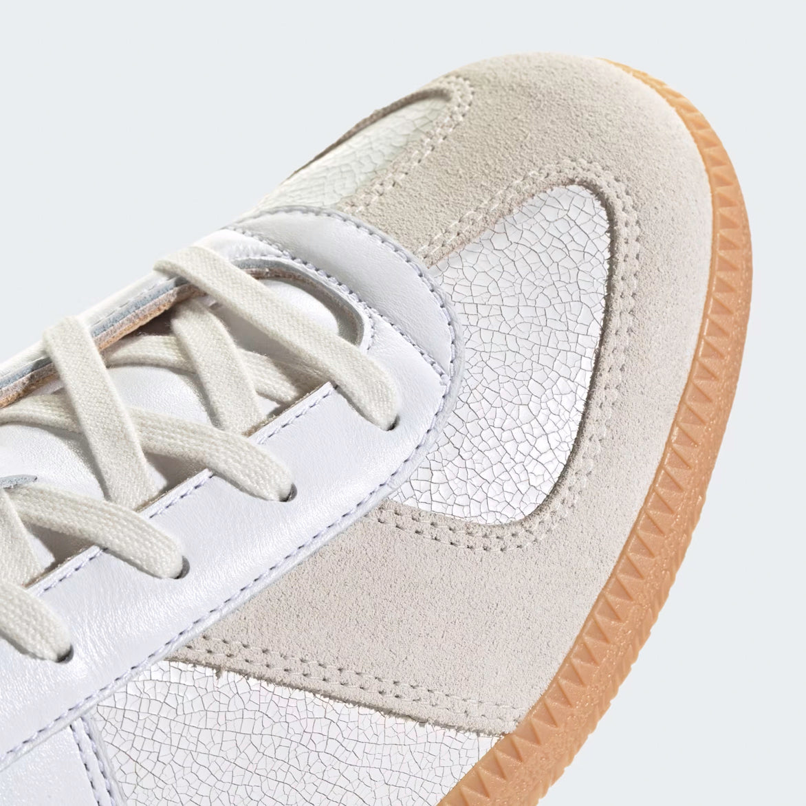 Side view of Cloud White luxury sneakers featuring a gum sole, ideal for everyday wear.