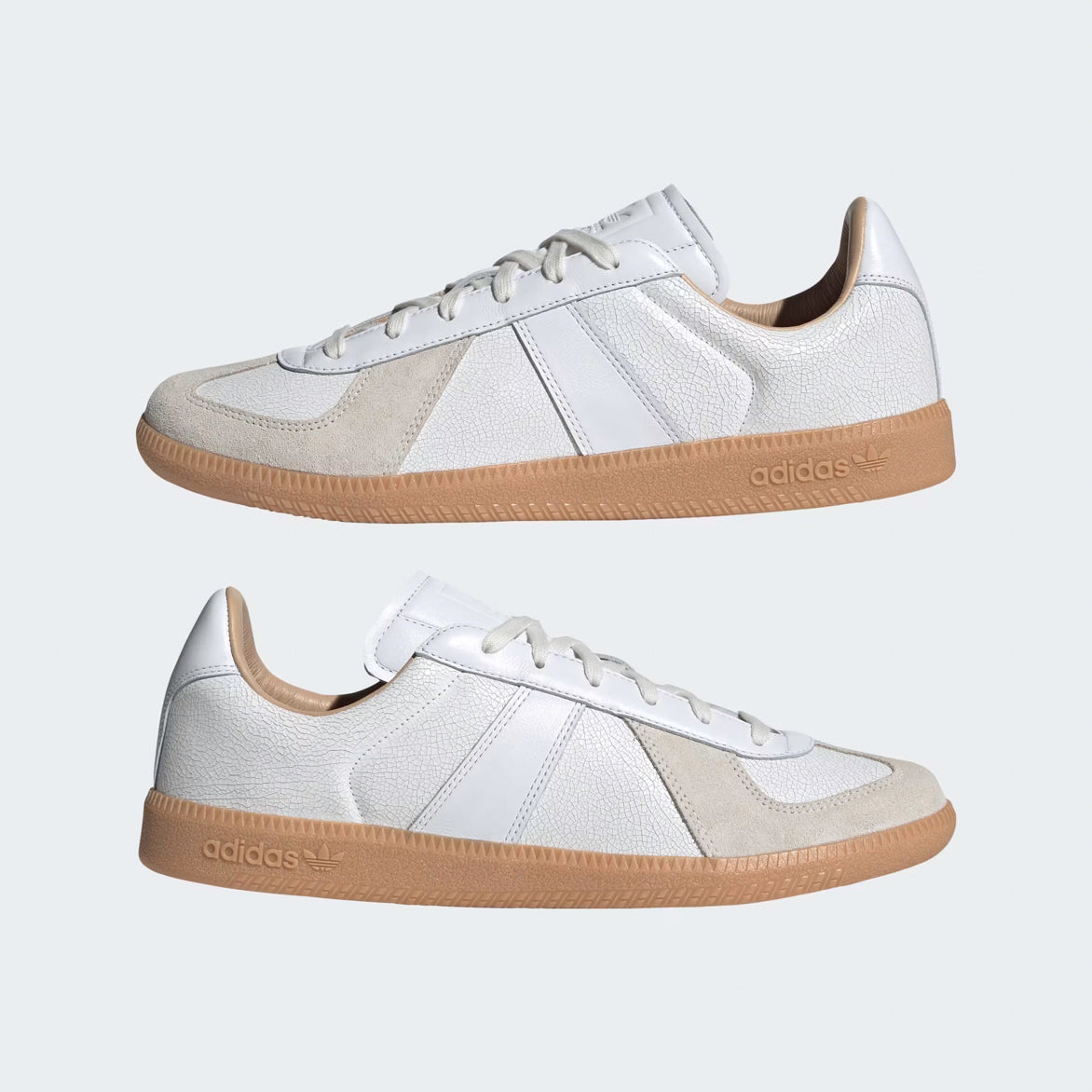 Close-up of the elegant white cracked leather upper and suede T-toe cap on the luxury sneakers.