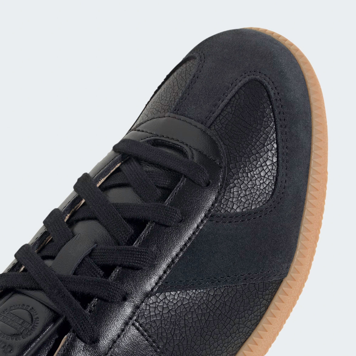 Top-down view of the Adidas BW Army Lux showcasing the sleek design and embossed branding on the tongue.