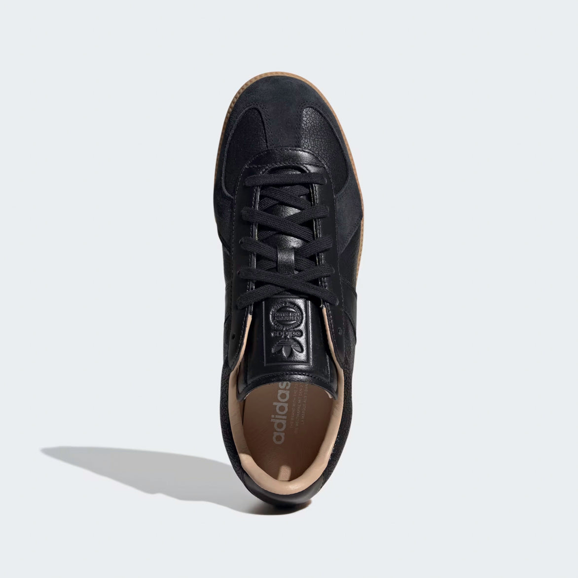 Side view of Adidas BW Army Lux sneakers highlighting the cracked leather upper and suede T-toe cap.