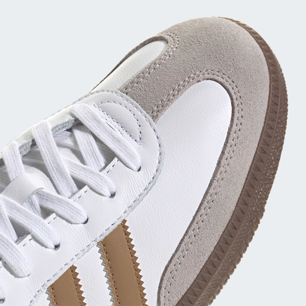Side view of Adidas Samba OG limited edition sneakers in cloud white and brown desert colors