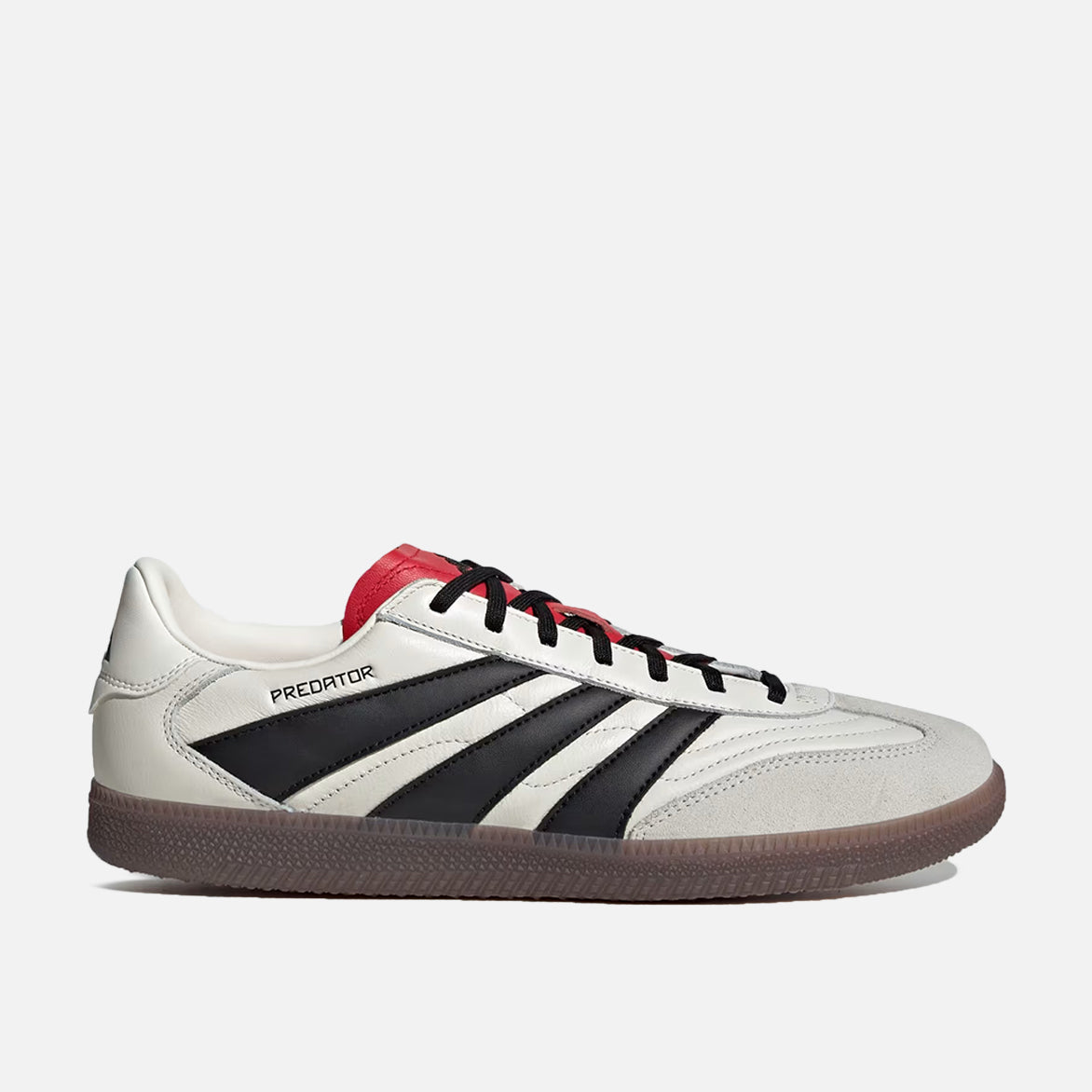Side view of Adidas Predator Freestyle indoor trainers showing stylish design and grip outsole