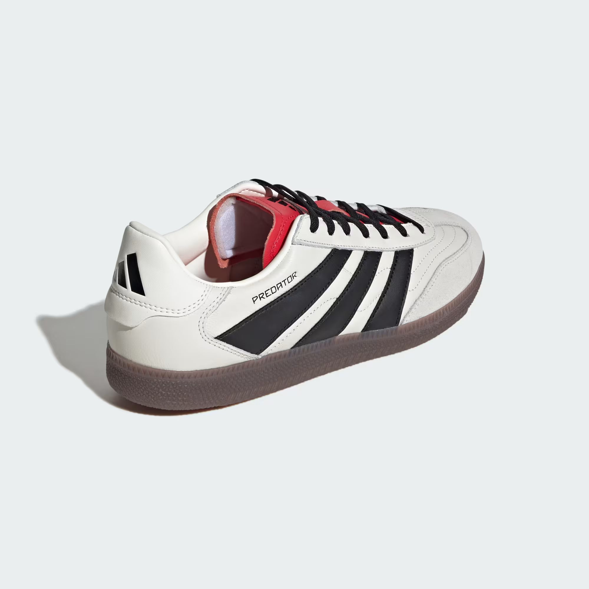 Feet in Adidas Predator Freestyle cleats during indoor soccer game demonstrating agility and comfort