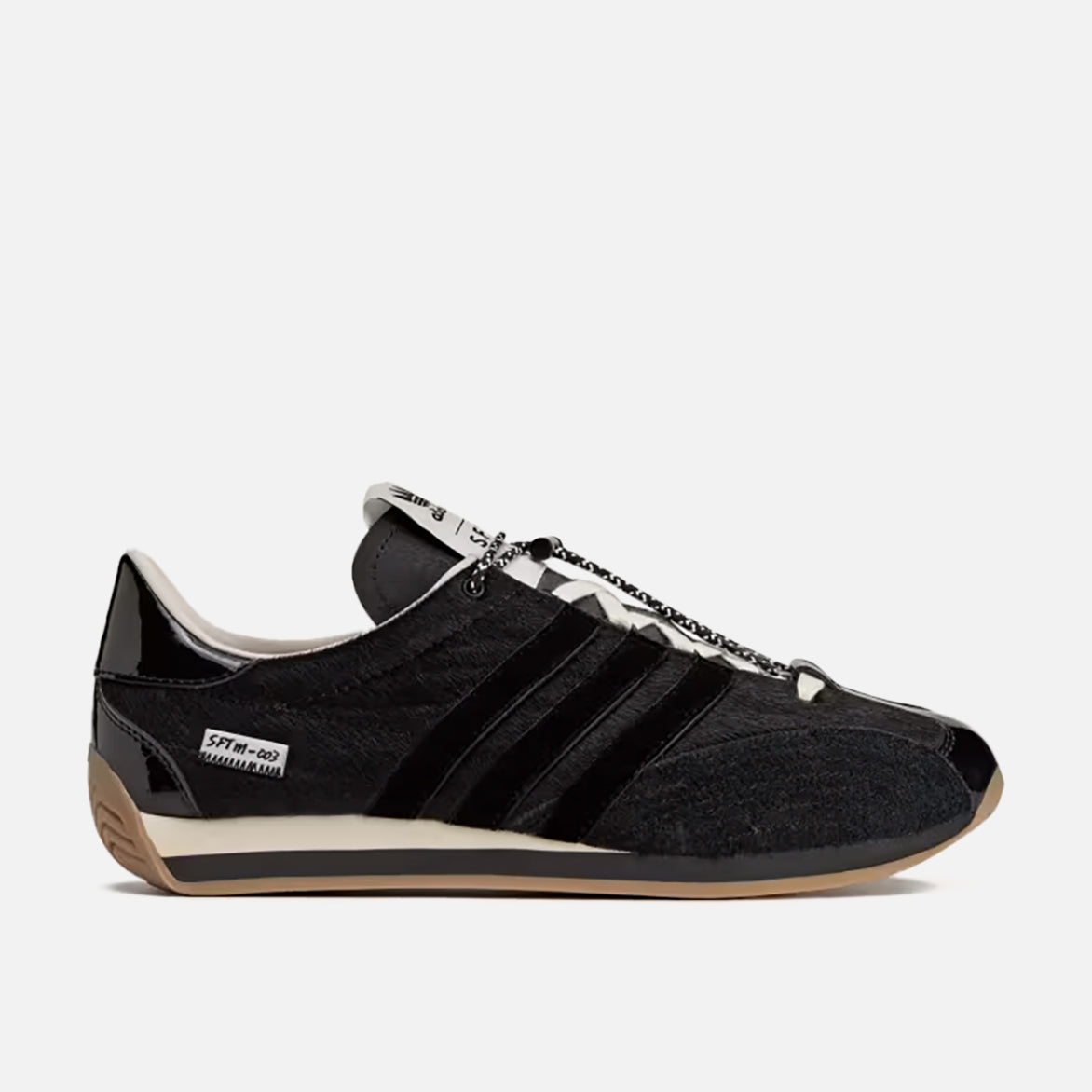 Close-up of the adidas Country OG by Song For The Mute, showing patent leather and suede texture