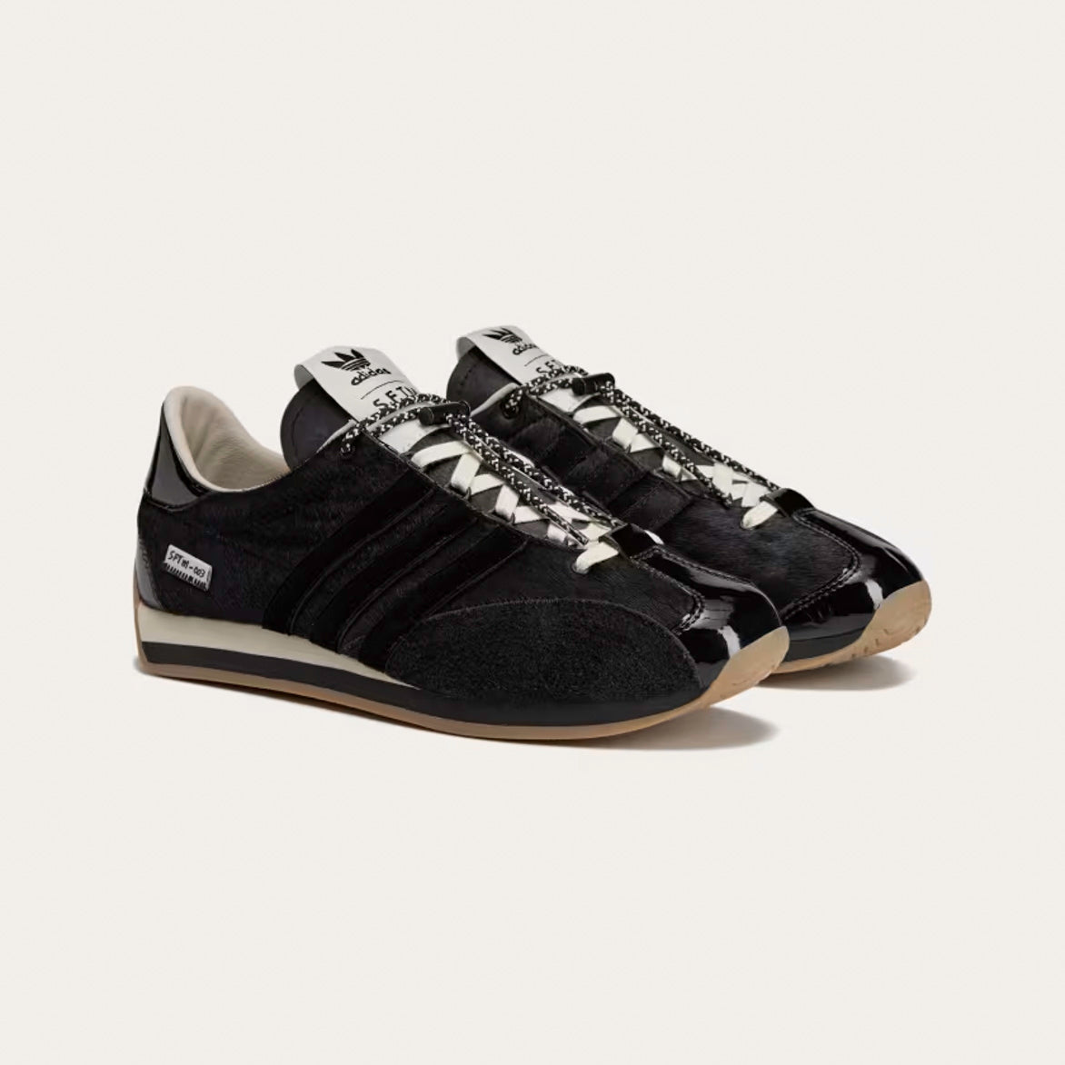 Overhead view of the limited edition shoes with hand-drawn co-branding and woven tags