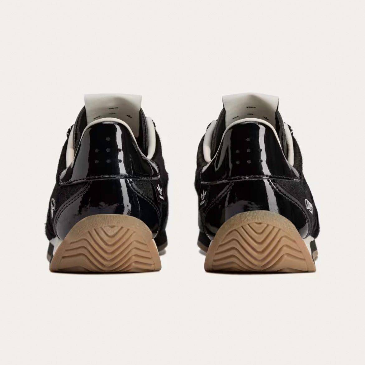 Overhead view of the limited edition shoes with hand-drawn co-branding and woven tags