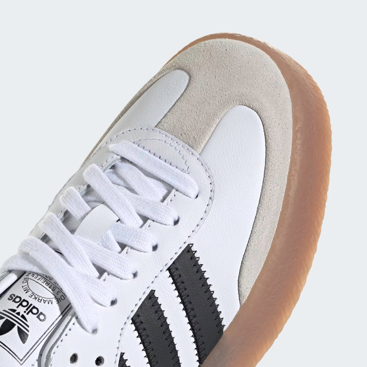 Adidas Sambae Cloud White sneakers worn in a casual setting, perfect for everyday fashion.
