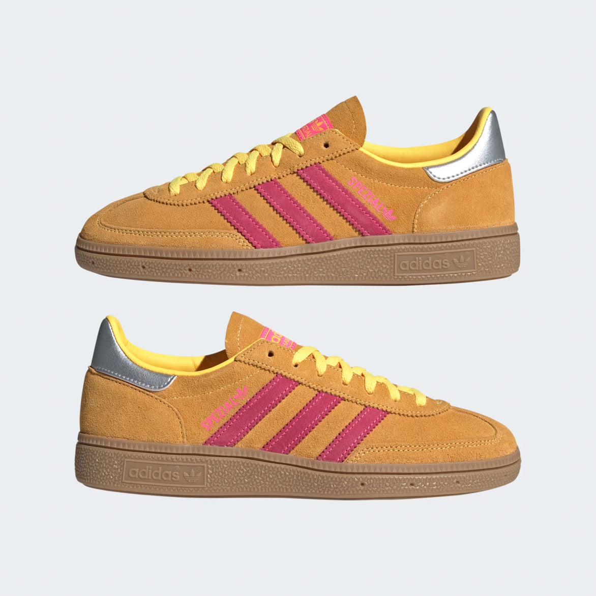 Close-up of the womens handball sneakers showcasing the pink and yellow tongue tag and laces.