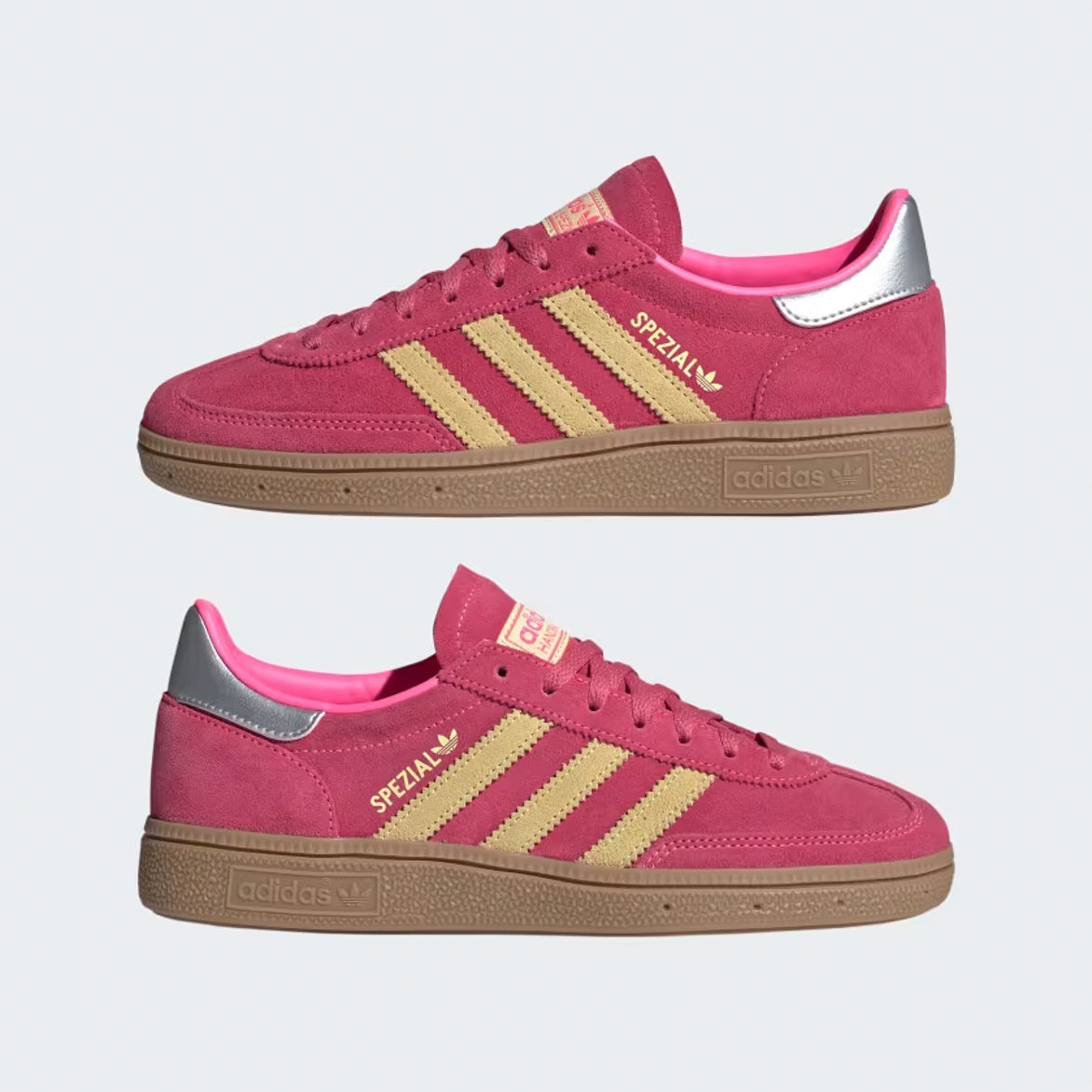 Top-down flat-lay of the limited women’s retro sneakers showing pink laces and yellow tongue tag