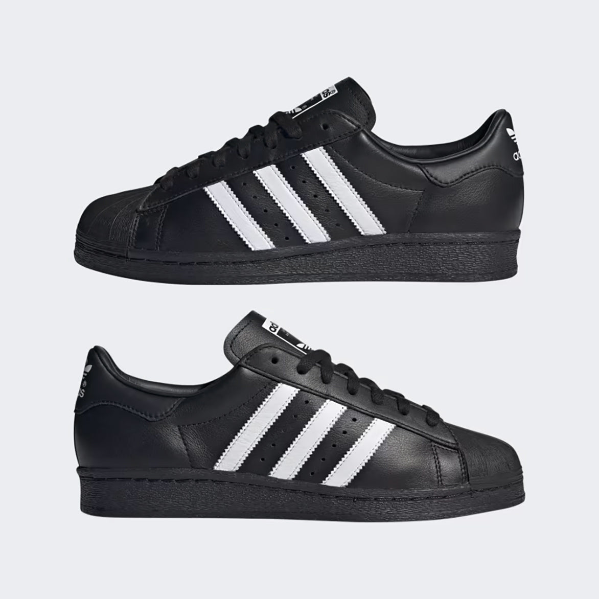 Side view of adidas superstar 1982 core black with white accents