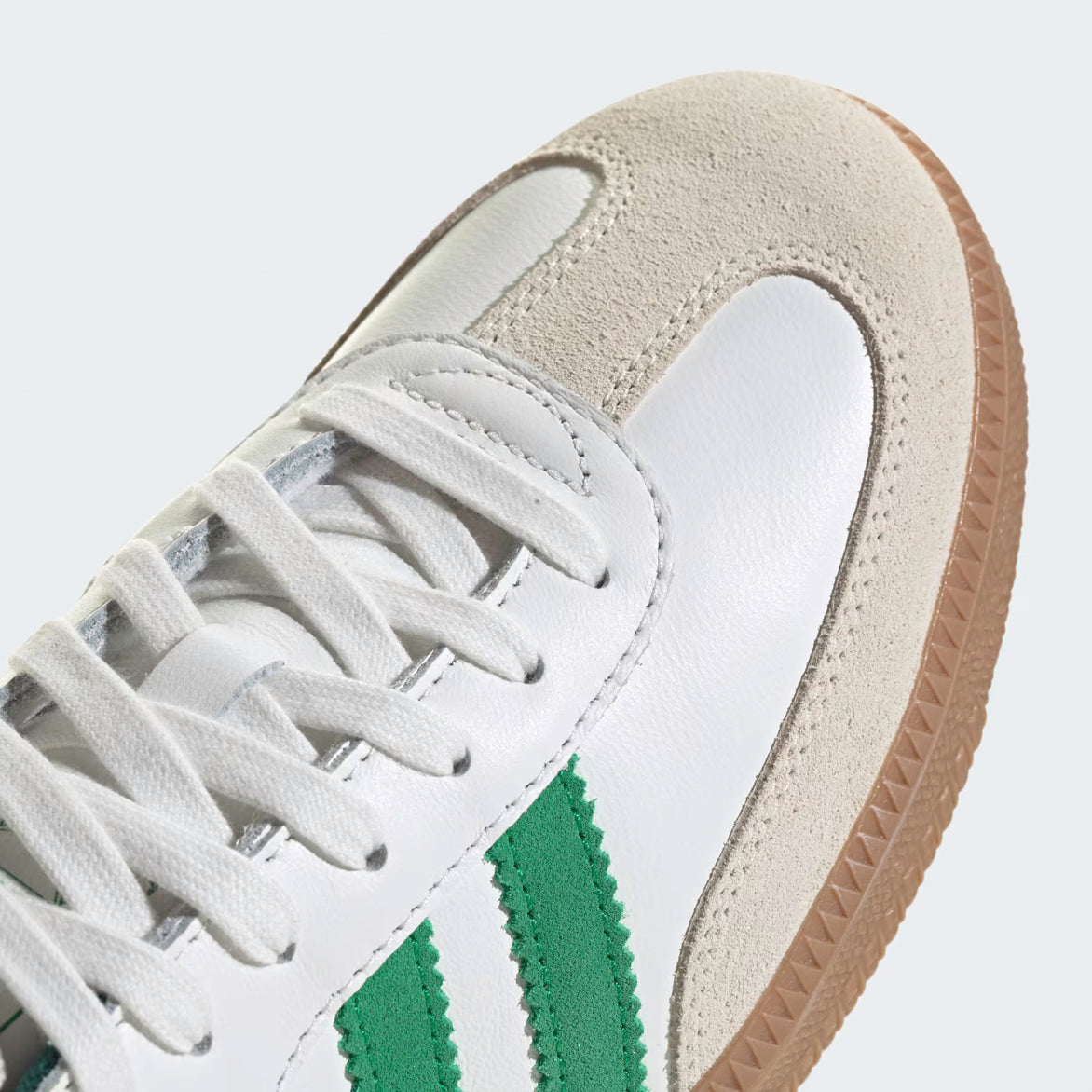Top-down shot of Adidas Samba OG shoes showing the white laces and Trefoil tongue tag
