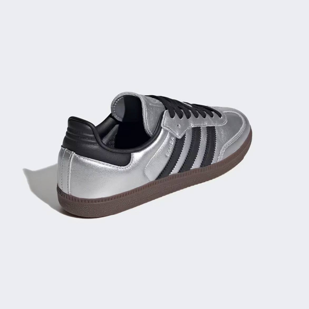 Front view of metallic silver womens sneakers with black accents