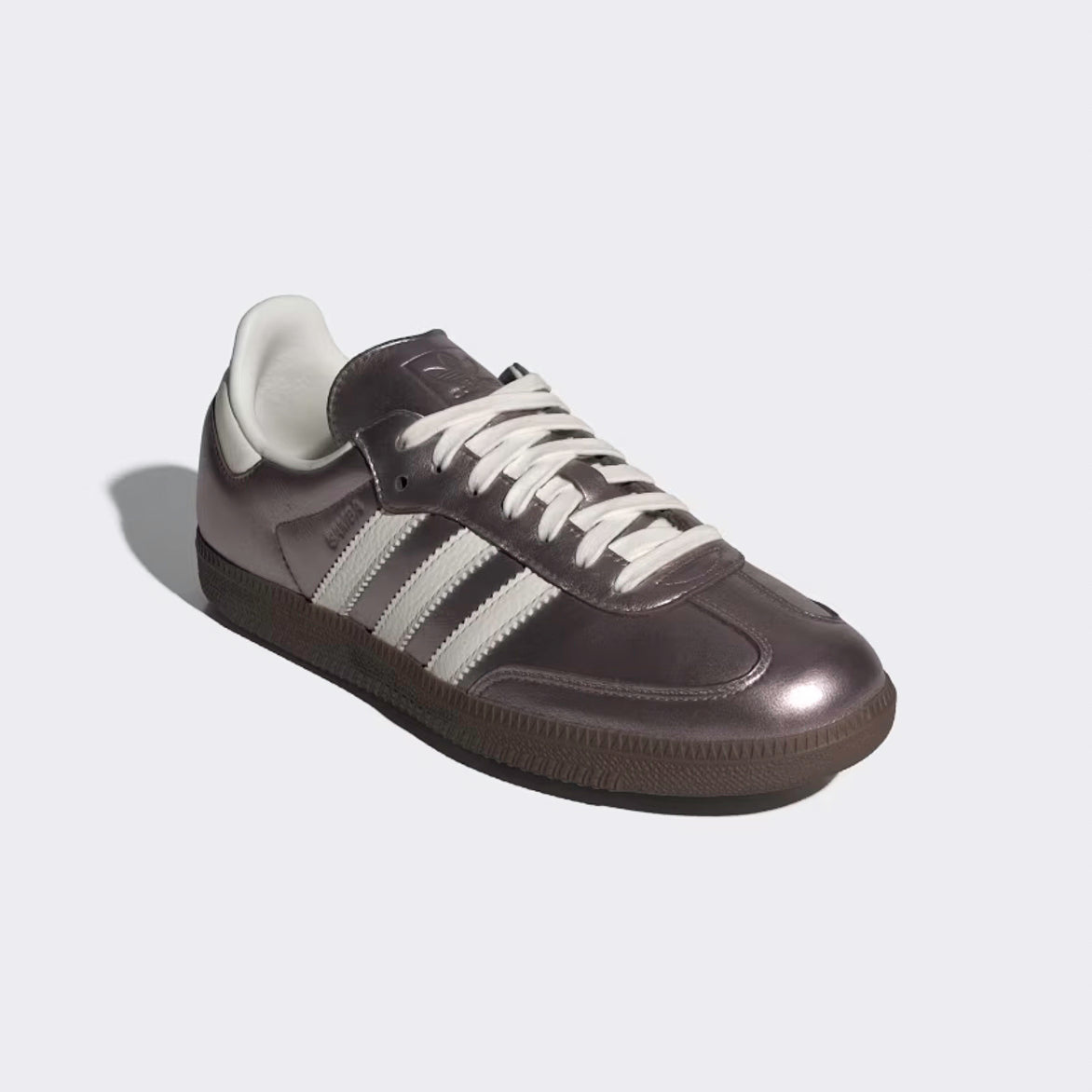 Top-down shot of women’s adidas samba sneakers in metallic purple for streetwear looks
