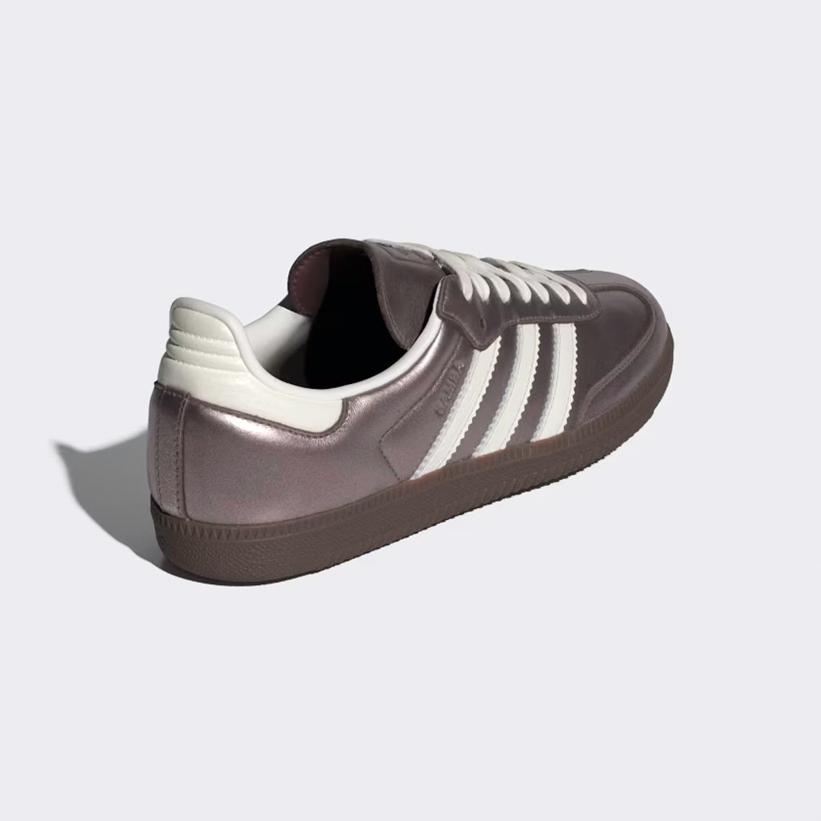 Close-up of the gum sole and debossed Trefoil branding on adidas samba OG purple shoes