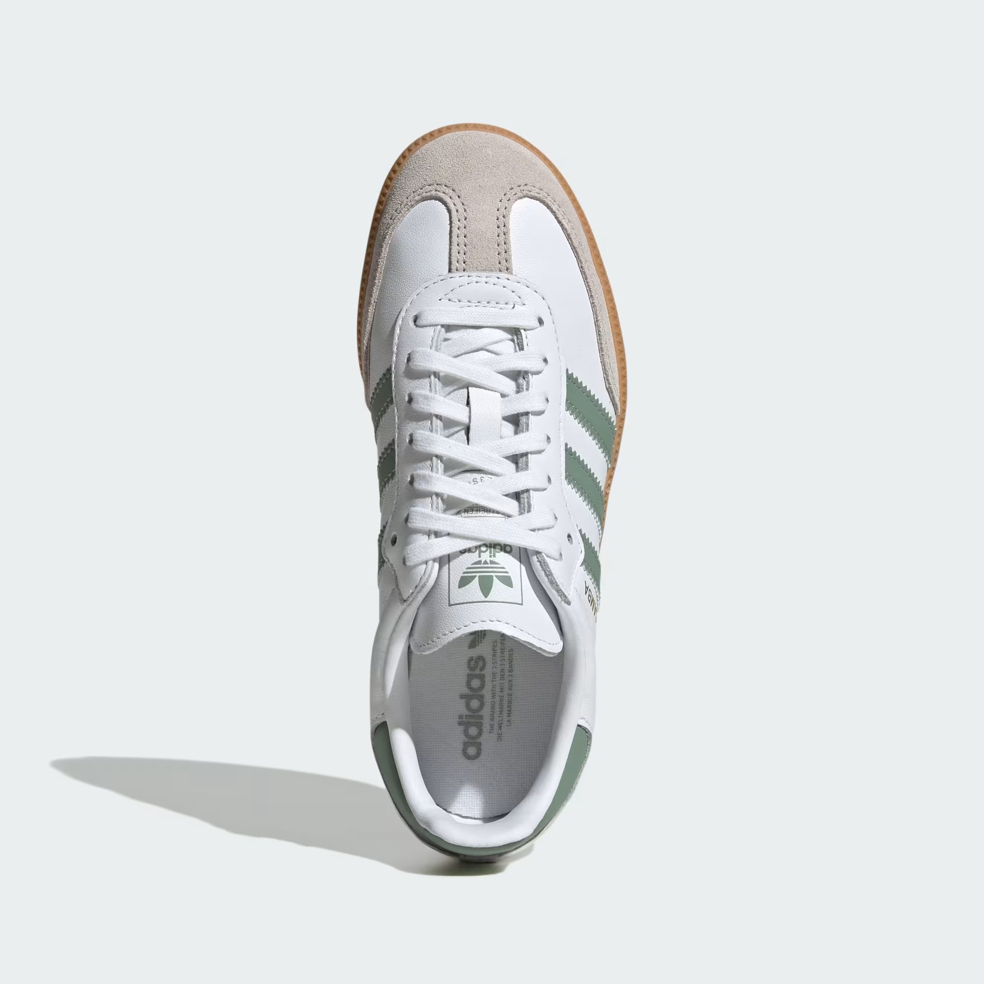 Side view of Adidas Samba kids sneakers showing the Cloud White and Silver Green colorway.