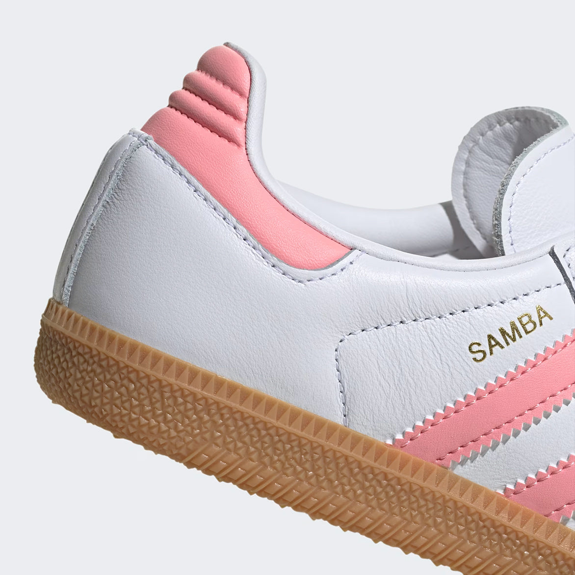Close-up of the Adidas Samba OG Kids Sneakers highlighting the pink synthetic leather stripes.