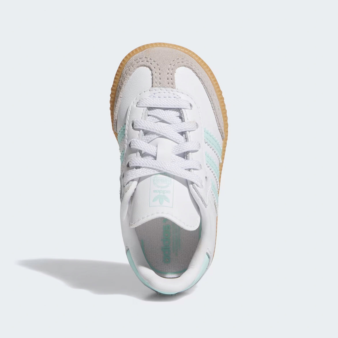 Side view of Adidas Samba OG kids sneakers in Cloud White and Aqua, highlighting the iconic three stripes.