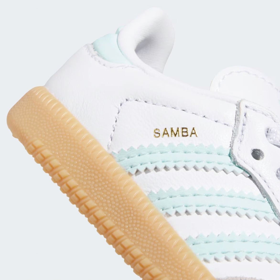 Close-up of the grey suede toebox overlay on Adidas Samba OG kids sneakers, emphasizing the quality craftsmanship.
